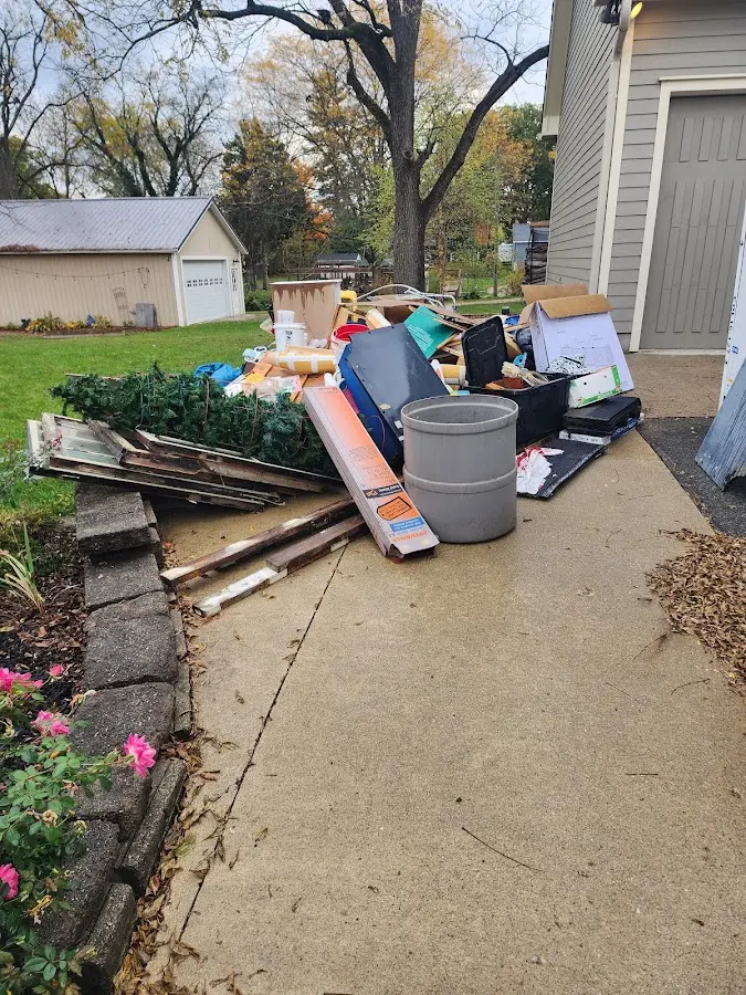 Dumpster being loaded with debris for Demolition Dumpster Rental in Hillandale